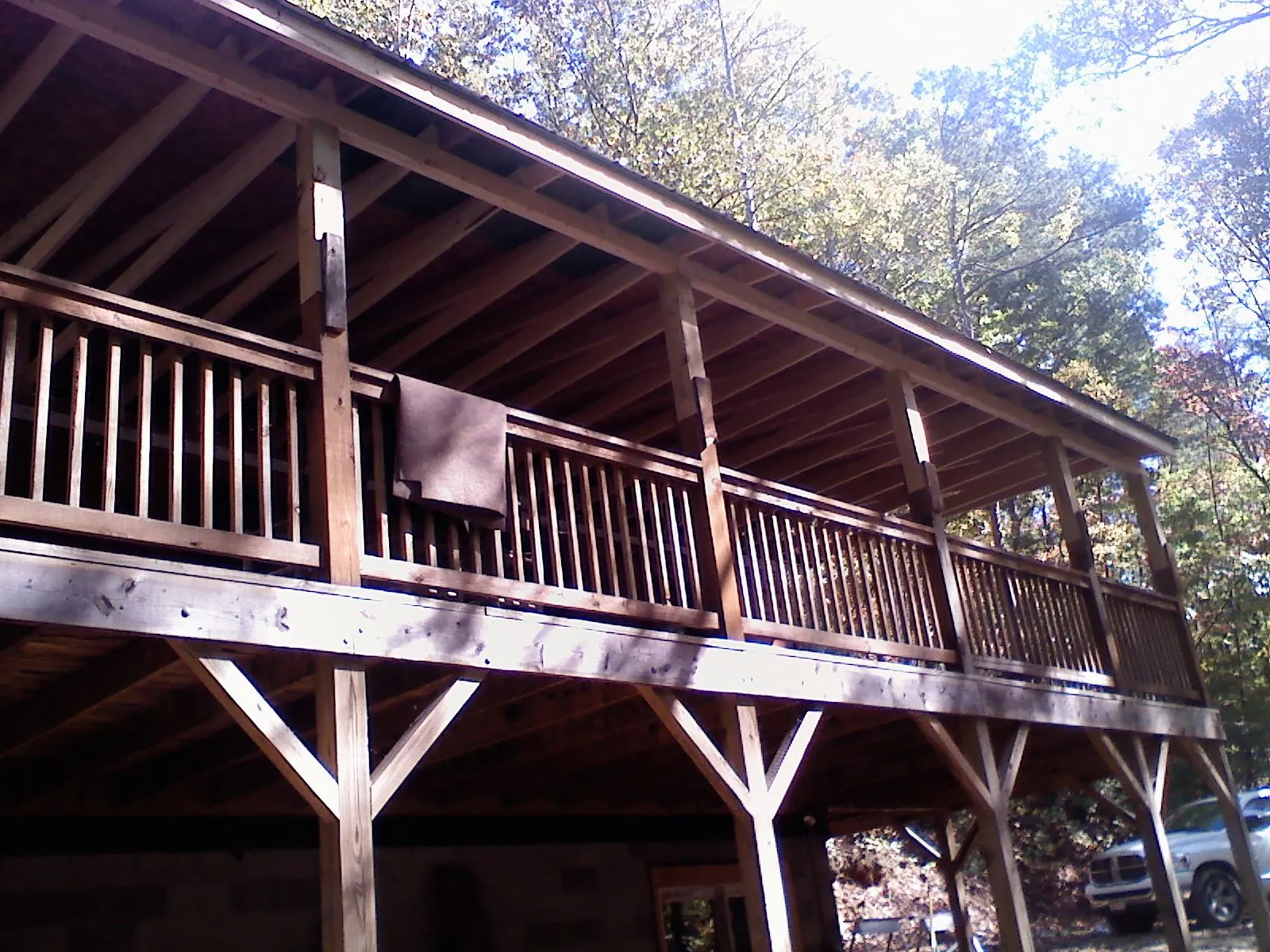 Timber framing under a new elevated porch and deck — Roof Leak Repair in New Century by Roofing Brothers